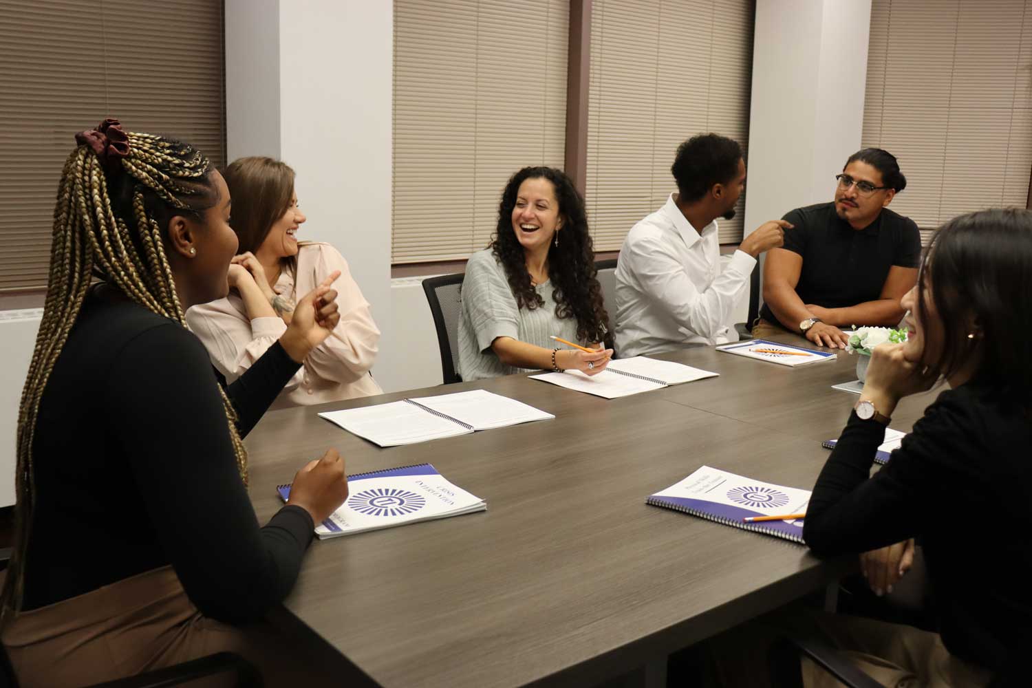 Professionals participating in a collaborative organizational training session